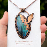 Copper labradorite dragon pendant